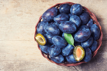 plums in basket
