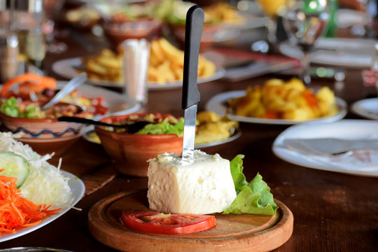 Cheese served on wooden board
