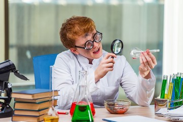 Young crazy chemist working in the lab