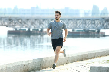 Young man jogging outdoors