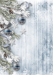 Christmas background with decorations and snow on wooden board
