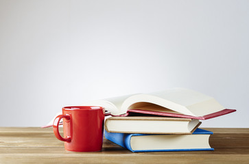 Books. With a coffee cup.