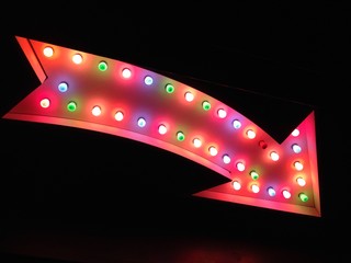 arrow sign neon vegas fairground funfair lights carnival circus vegas style real arrow pointing at...