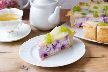 Homemade cheesecake with blueberries, pineapple, grapes and jelly. Russian quark cake
