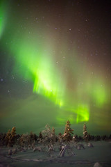 Naklejka na ściany i meble Northern Lights in Lapland, Finland.