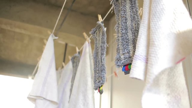 doormats are dried on the clothesline. towels on clothesline. cloth in the wind