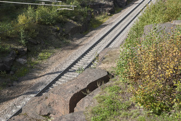 Fototapeta premium Railroad laid among the rocks. View from above