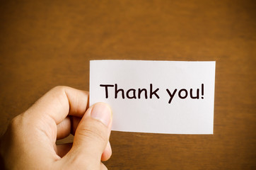 Hand holding thank you card