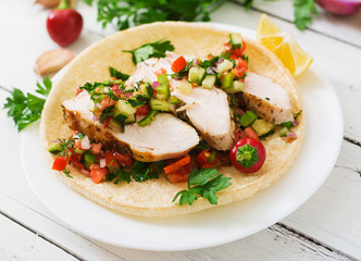 Mexican tacos with chicken and salsa.