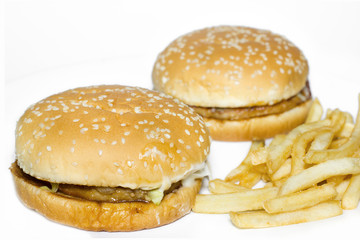 Fast food tasty beef burger with fried potatoes.