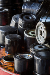 Picture of old fuel filters of diesel engines. Old car or automobile oil filters represented in automobile service center.