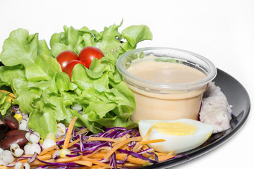 Fresh vegetable salad on white background.