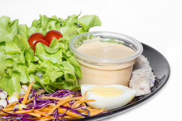 Fresh vegetable salad on white background.