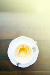 Empty coffee cup after drink on wood table