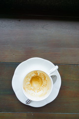 Empty coffee cup after drink on wood table