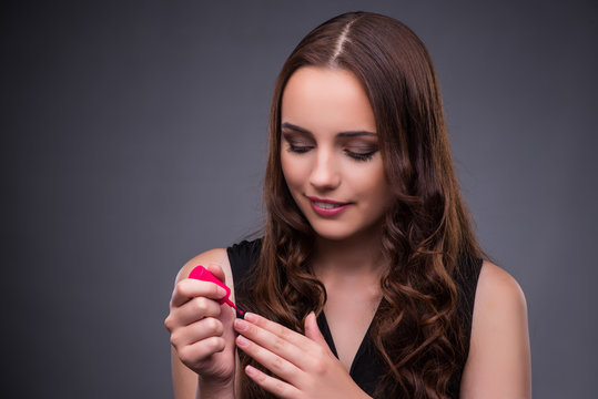 Beautiful woman applying make-up in fashion concept 