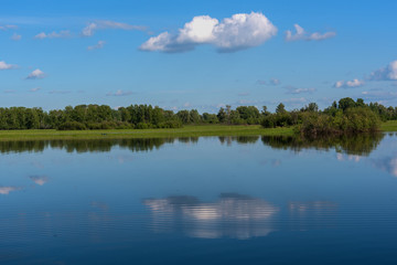 Obraz na płótnie Canvas lake reflection clouds sky trees