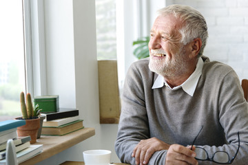 Senior Adult Looking Outside WIndow Relax Concept