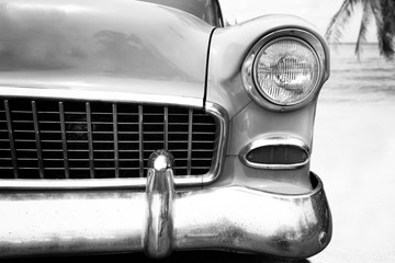 headlight lamp vintage classic car parked,  black and white vintage film grain filter effect styles