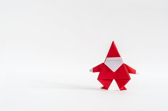 Santa Claus paper craft on white background.