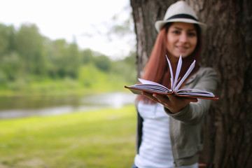 girl with book in park