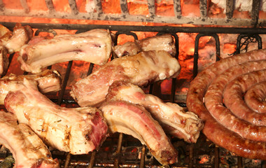 many pork ribs and tasty spicy sausage