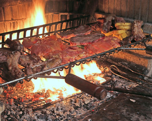 hot fire to cook pork ribs and tasty spicy sausage grilled