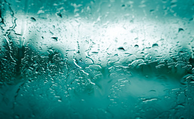  rain drops on front car green glass