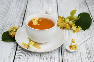cup of herbal tea with linden flowers