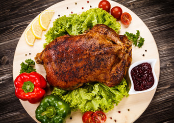 Roast duck on cutting board 