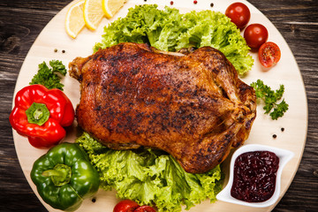 Roast duck on cutting board 