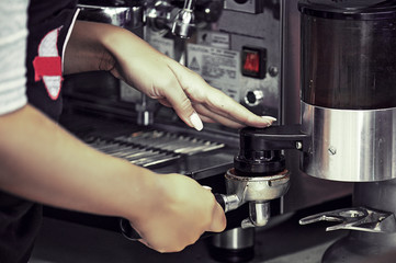 Barista Grinding Coffee
