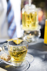 Hot tea cup on a frosty winter day window background