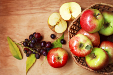 Fototapeta na wymiar organic apples in a basket on a wooden table