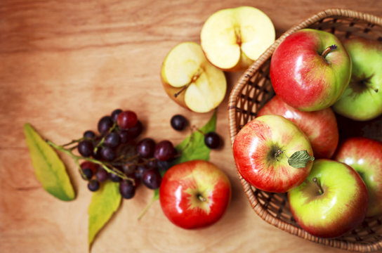 organic apples in a basket on a wooden table