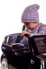 Super driver - little boy playing with big black toy car