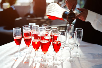 Red juice drinks in crystal glasses