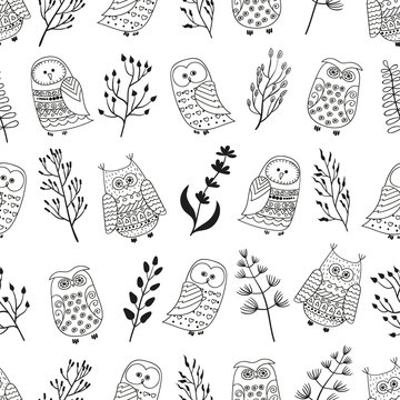 Seamless pattern with cute doodle owls and branches. Black and white vector background.