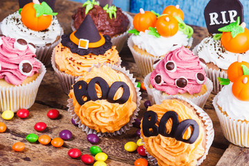 Halloween cupcakes with colored decorations
