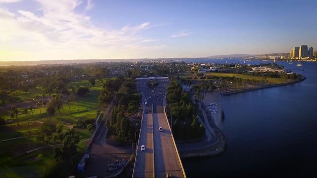 Aerial view of traffic on bridge during sunset in San Diego California.  