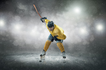 Ice hockey player on the ice, outdoors