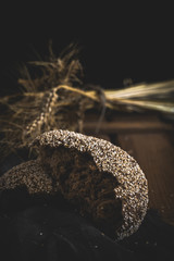 Different fresh bread on old wooden table