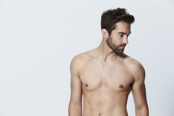 Fototapeta premium Shirtless dude looking away in studio
