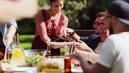 happy friends having dinner at summer garden party - Powered by Adobe
