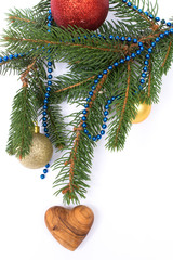 Fototapeta premium Christmas greeting card. Fir with balls and heart on white backg