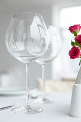 Close-up of two wine glasses on cafetable