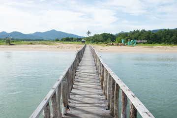 Fototapeta na wymiar a wooden platform across the beach line, use for crossing to boat to beach upon high tide or low tide