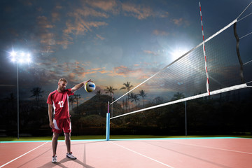 Professional volleyball player in action on the night court