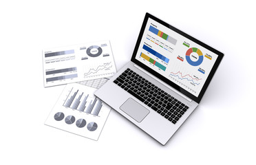 ノートパソコンとビジネス資料