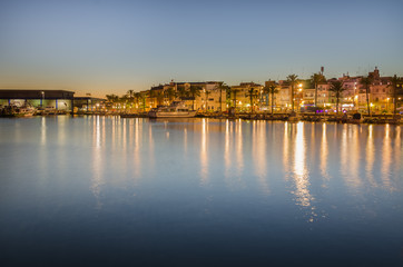 Fototapeta na wymiar Quay of port in Tarragona in sunset light, Spain